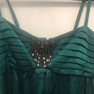 Embellished emerald green cocktail dress.
